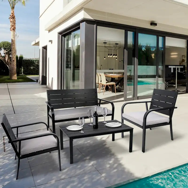 Ensemble de conversation de patio en acier 4 pièces avec coussins et table basse